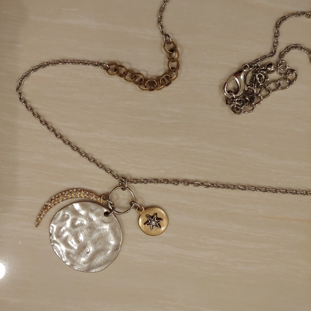 Silver pendant with moon and star accent